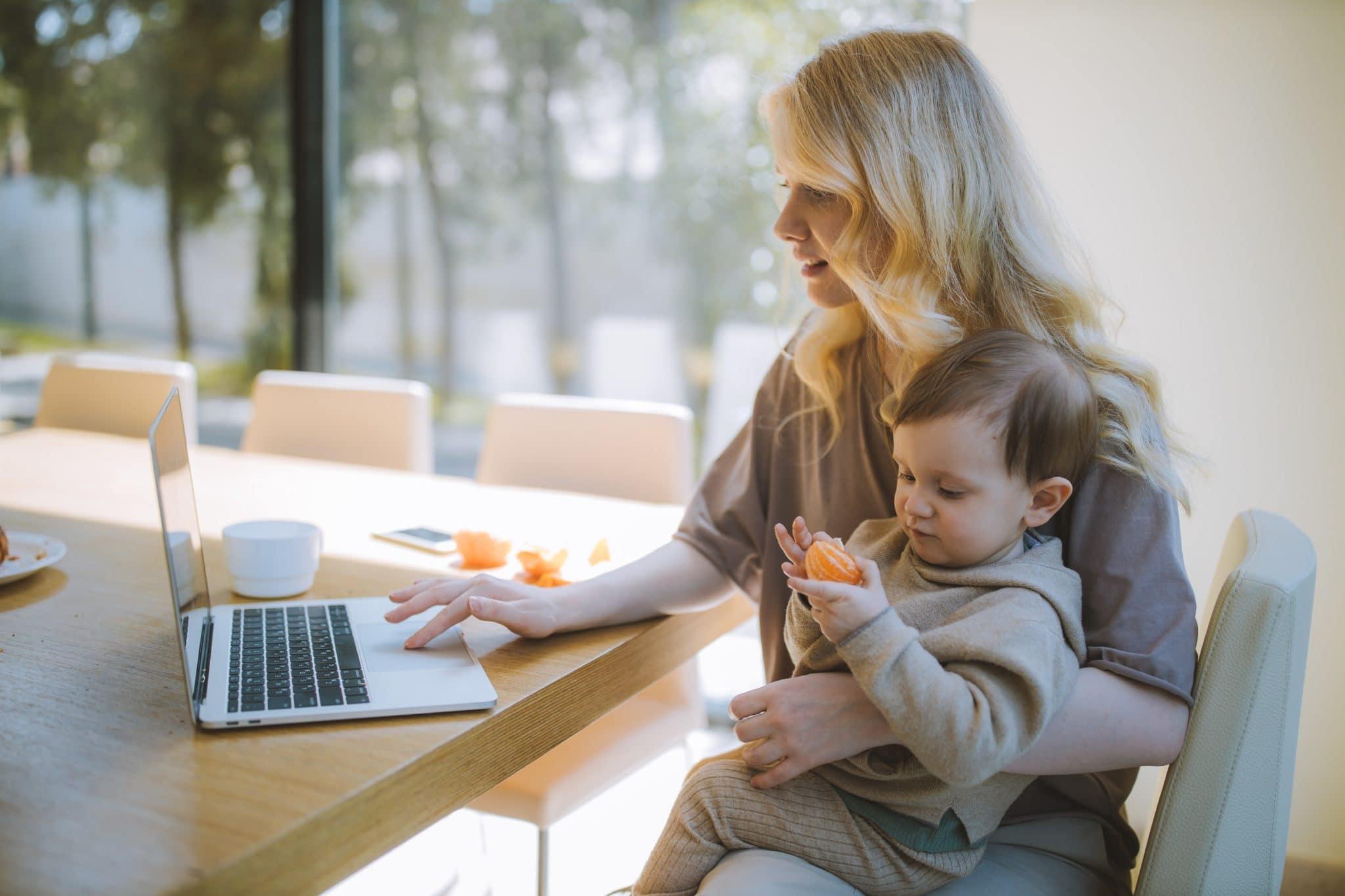 Woman with her working on a laptop